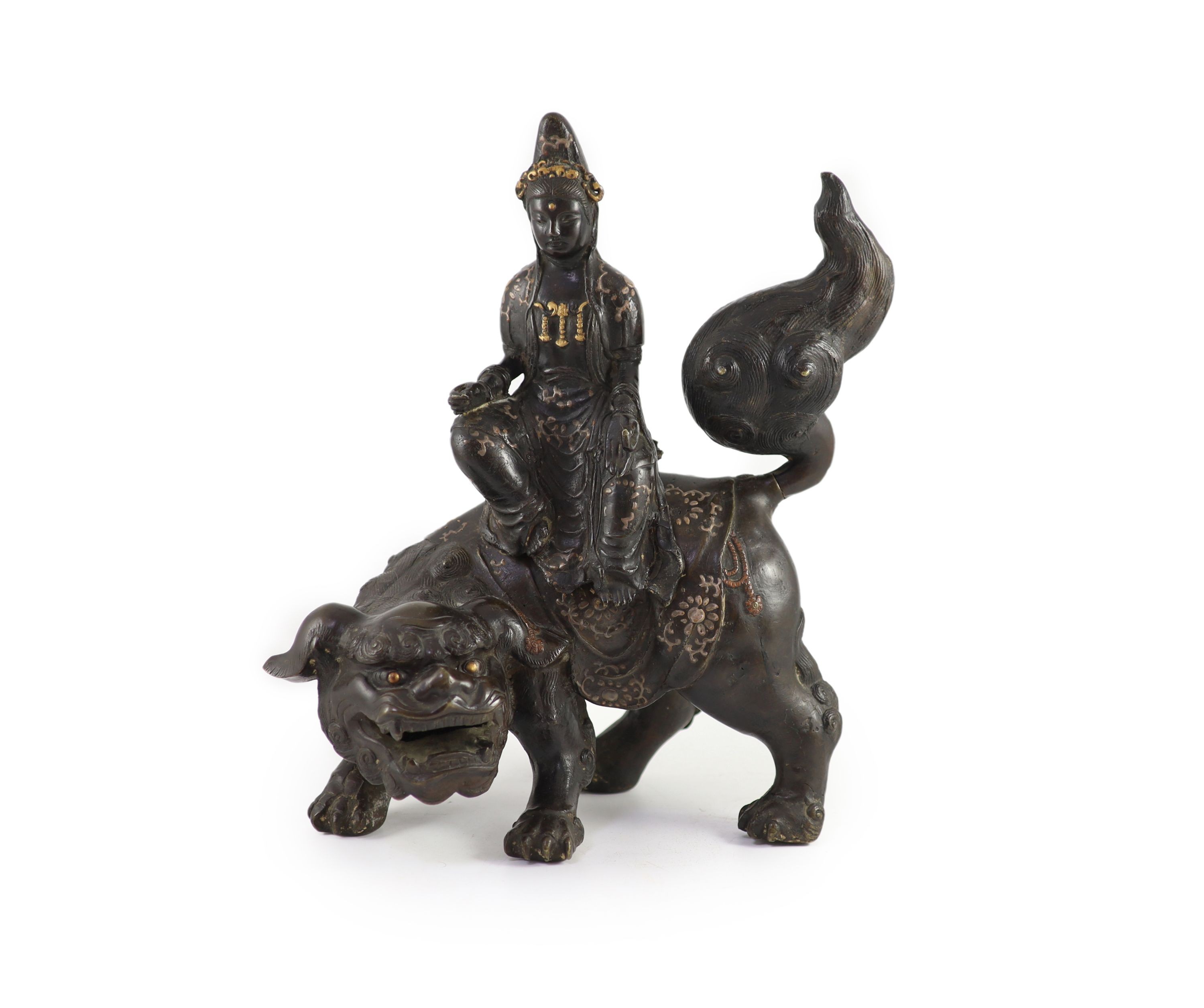 A large Chinese/Japanese bronze censer modelled as Wenshu riding a lion-dog, 17th/18th century 40 cm high, 35 cm long